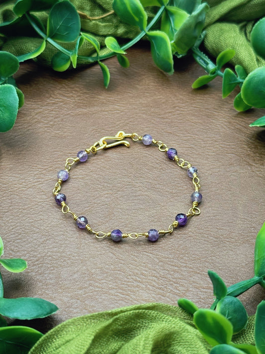 Handmade beaded chain bracelet featuring wire links and purple amethyst beads.
