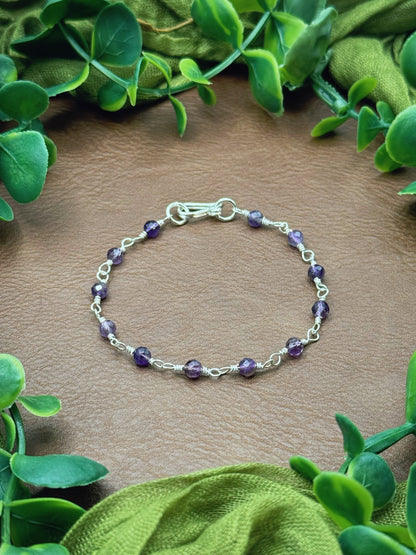 Handmade beaded chain bracelet featuring wire links and purple amethyst beads.