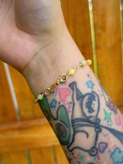 Handmade beaded chain bracelet featuring wire links with olive green and crystal beads.