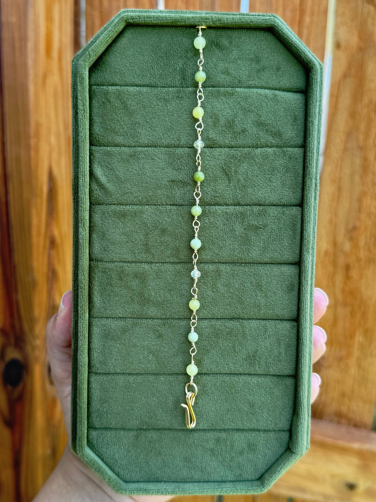 Handmade beaded chain bracelet featuring wire links with olive green and crystal beads.
