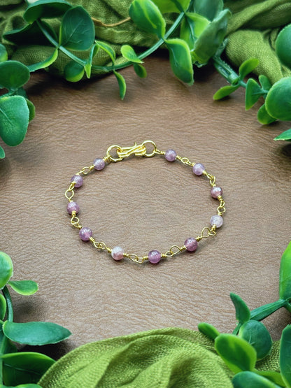 Handmade beaded chain bracelet featuring wire links and purplish pink lepidolite gemstone beads.