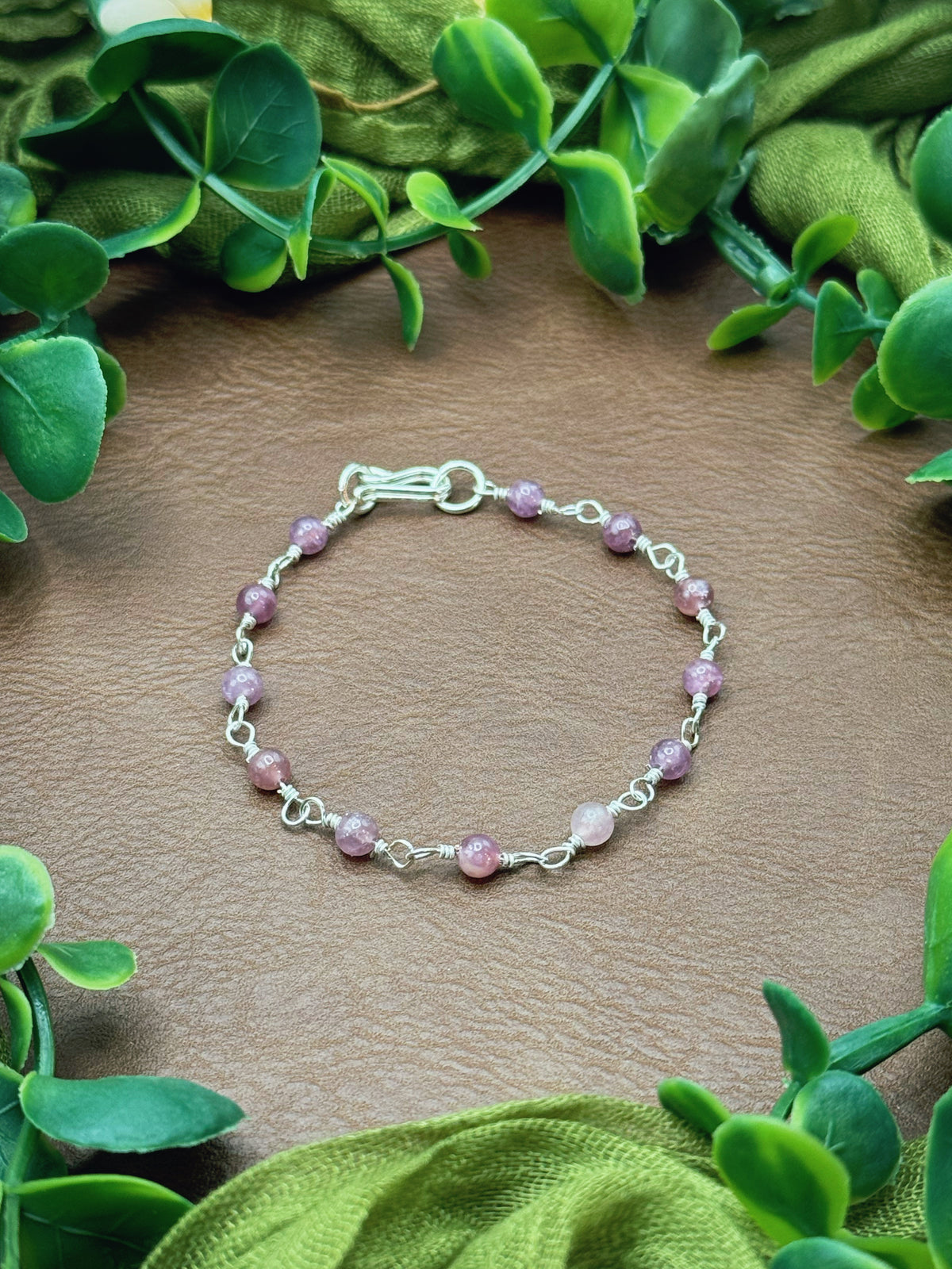 Handmade beaded chain bracelet featuring wire links and purplish pink lepidolite gemstone beads.