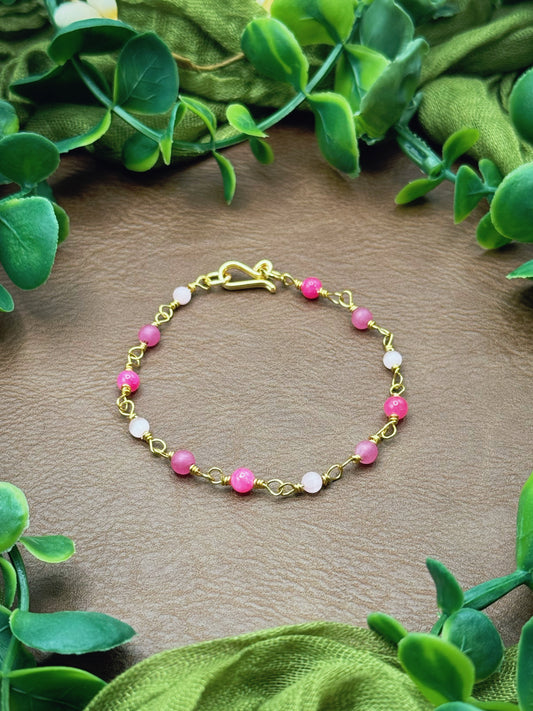 Handmade beaded chain bracelet featuring wire links and pink beads.