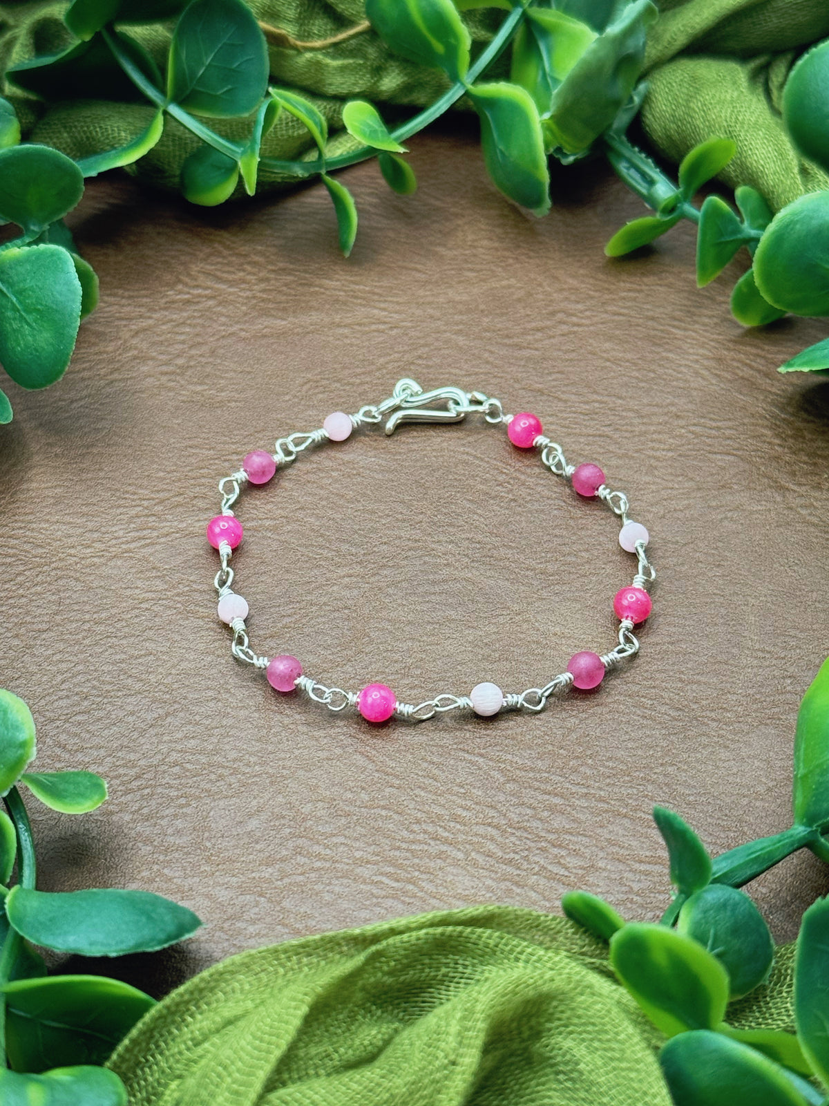 Handmade beaded chain bracelet featuring wire links and pink beads.