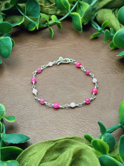 Handmade beaded chain bracelet featuring wire links and pink beads.