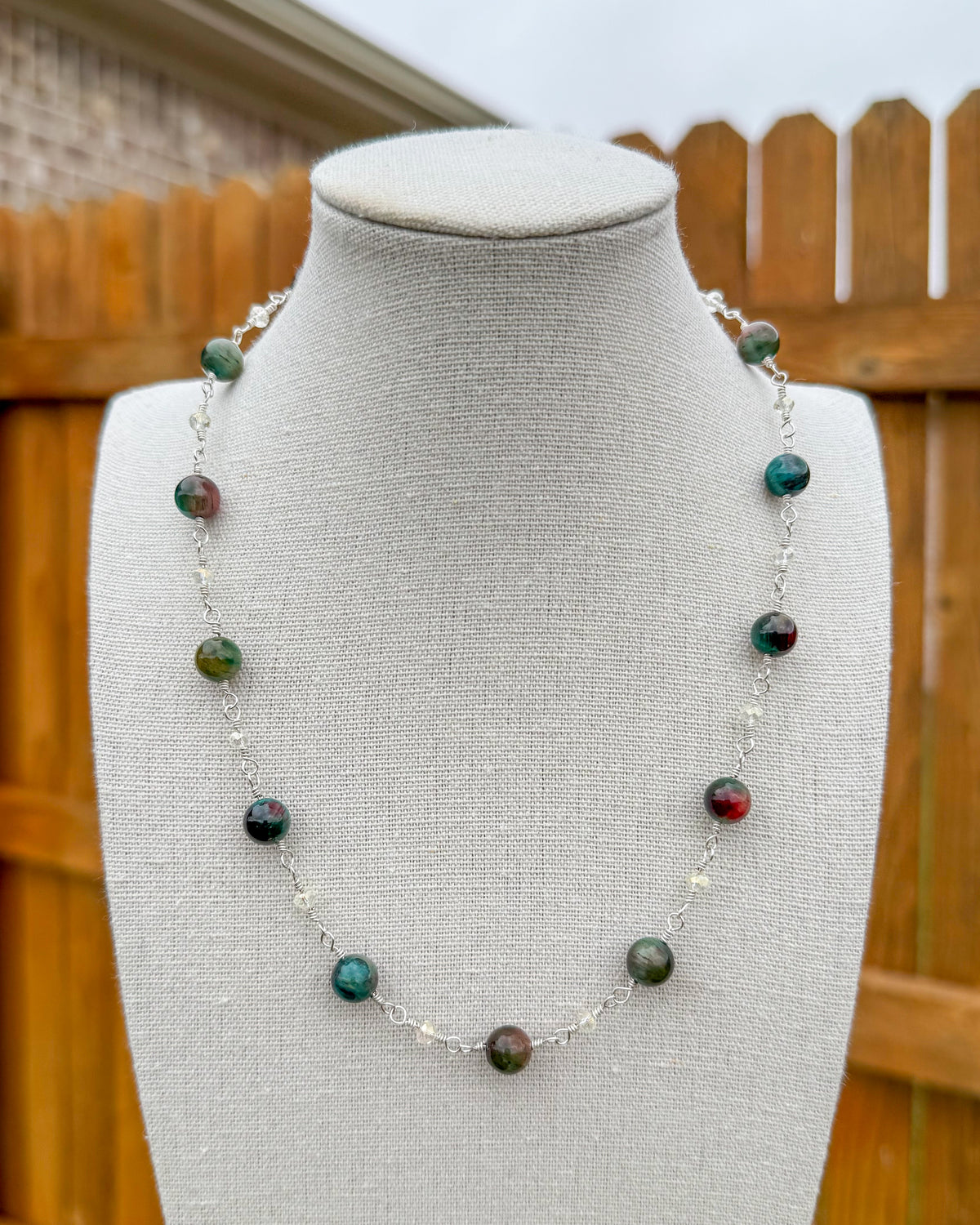 Beaded necklace featuring handmade wire links with colorful gemstone beads and Czech crystals.