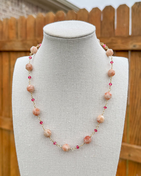 Beaded necklace featuring handmade wire links with sunstone gemstone beads and glass seed beads.